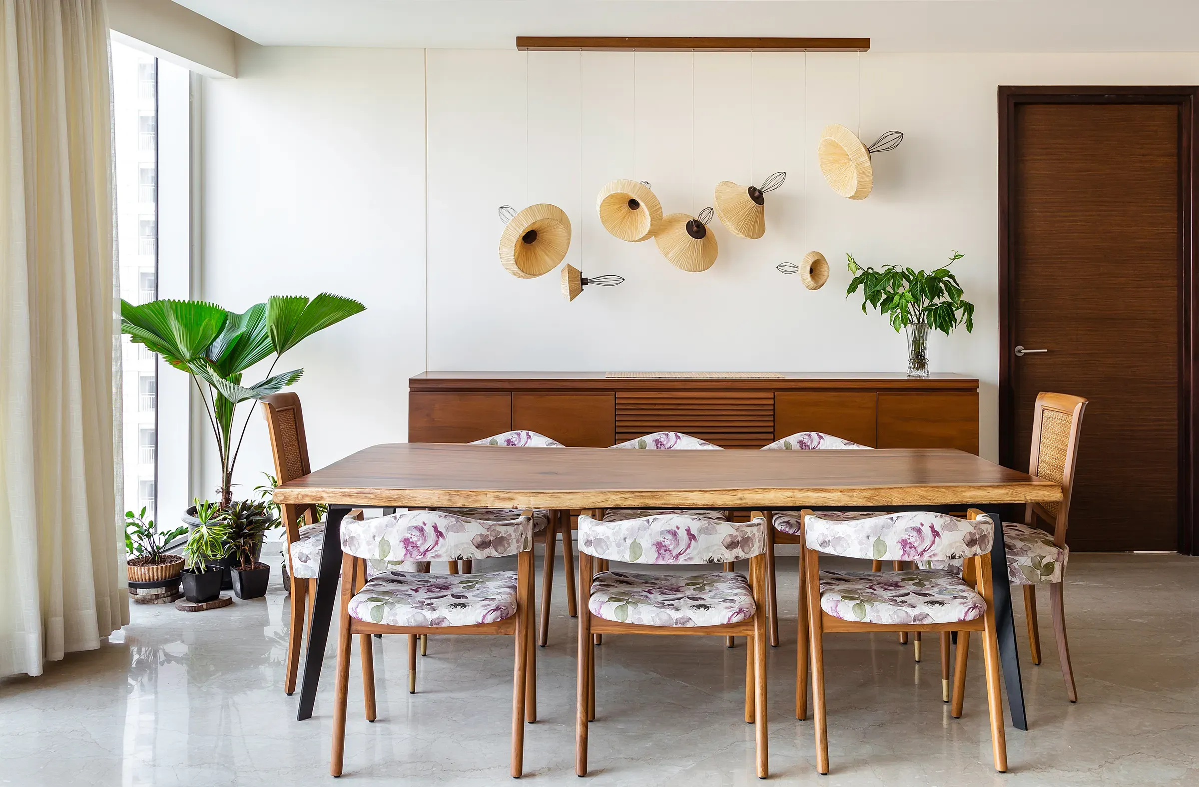The log dining table and louvered sideboard