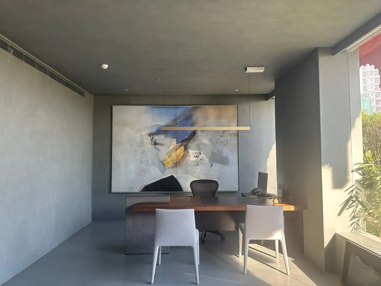The timber desk and abstract canvas at the RPG office