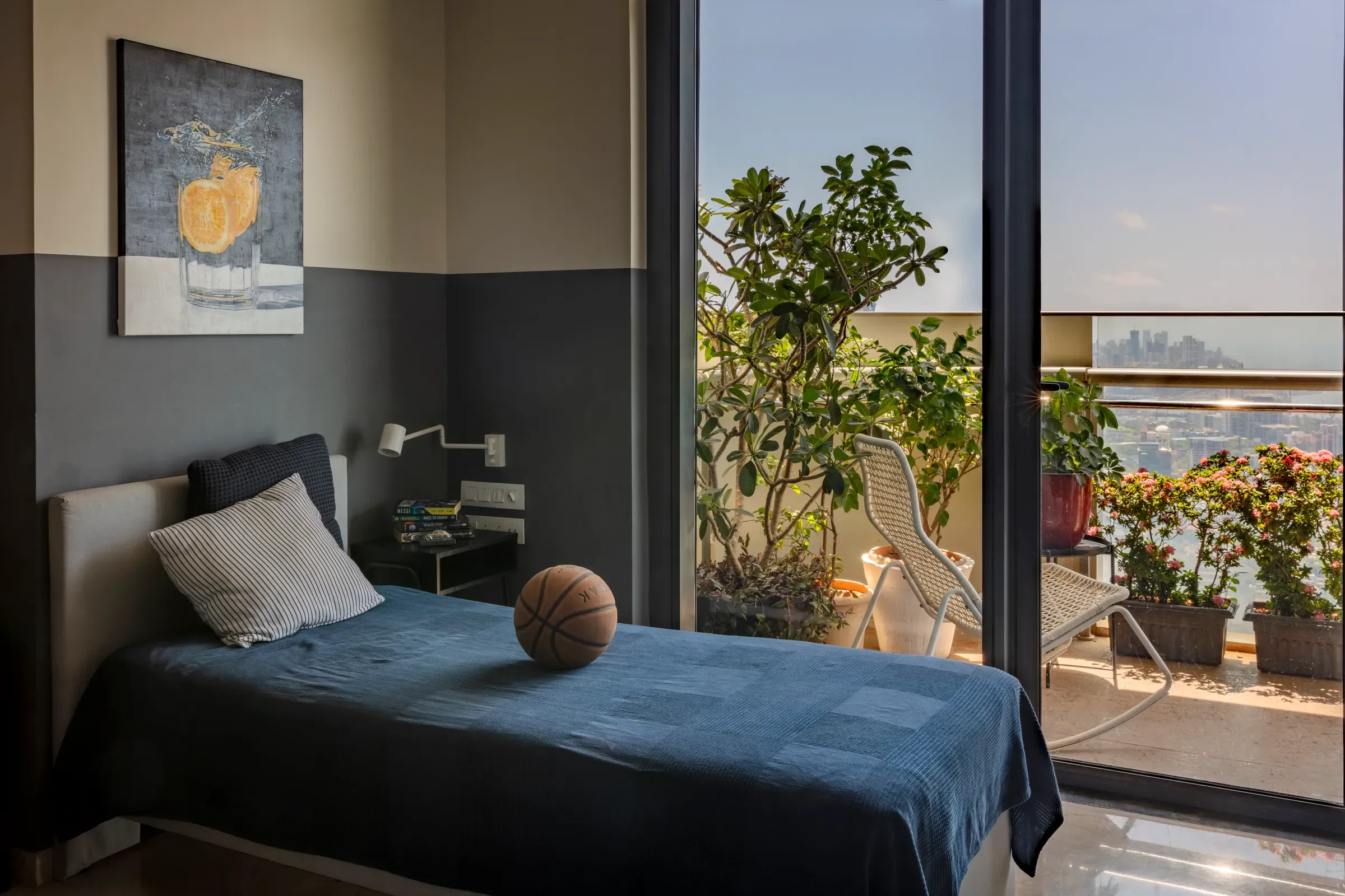 A bedroom opening to the planted balcony at The Open Horizon