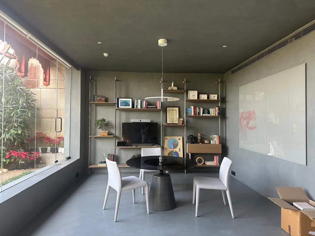 The brass shelving and courtyard glazing at the RPG office