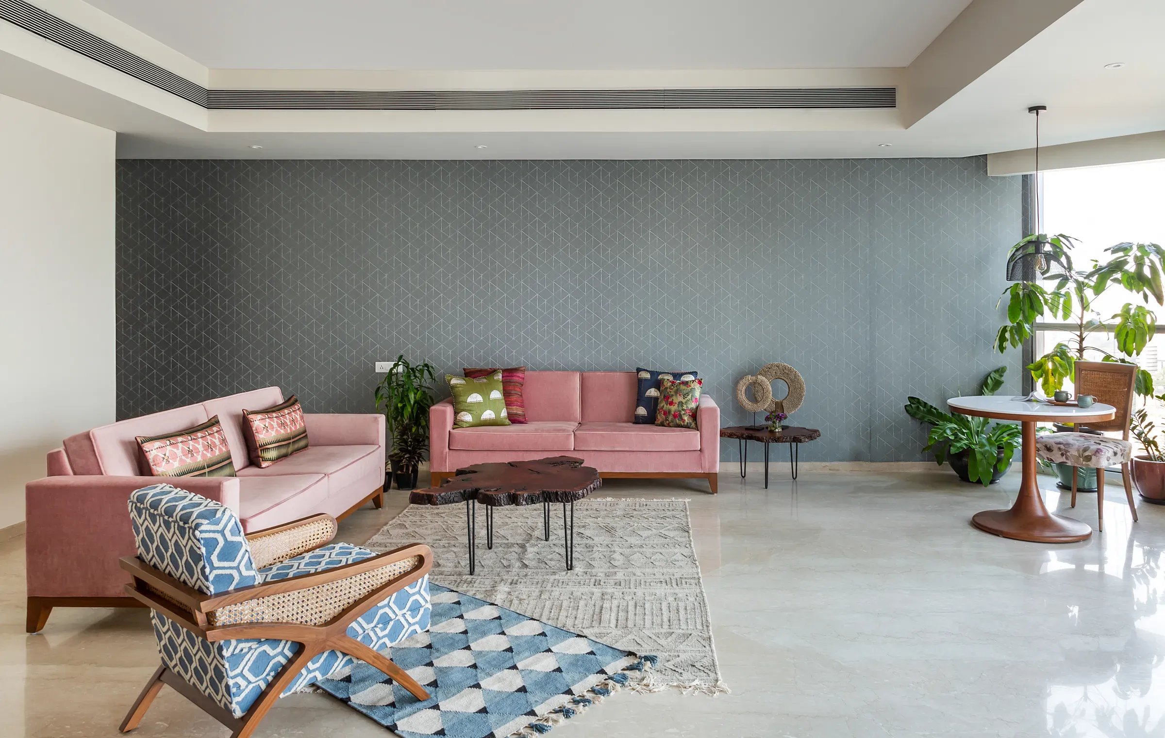 The living room of the mid-century apartment, seen wide