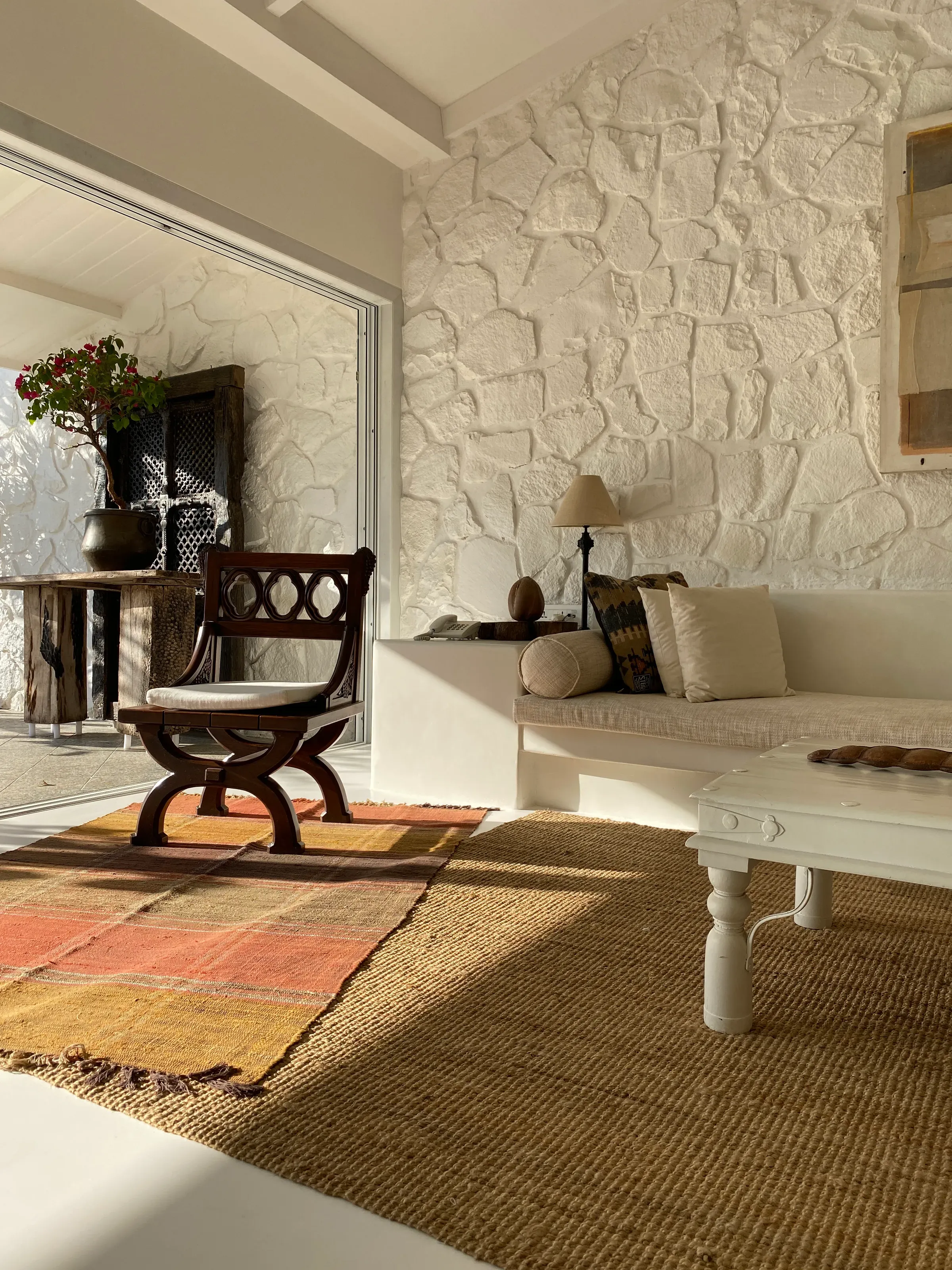 A carved chair beside the stair at the Marve beach house