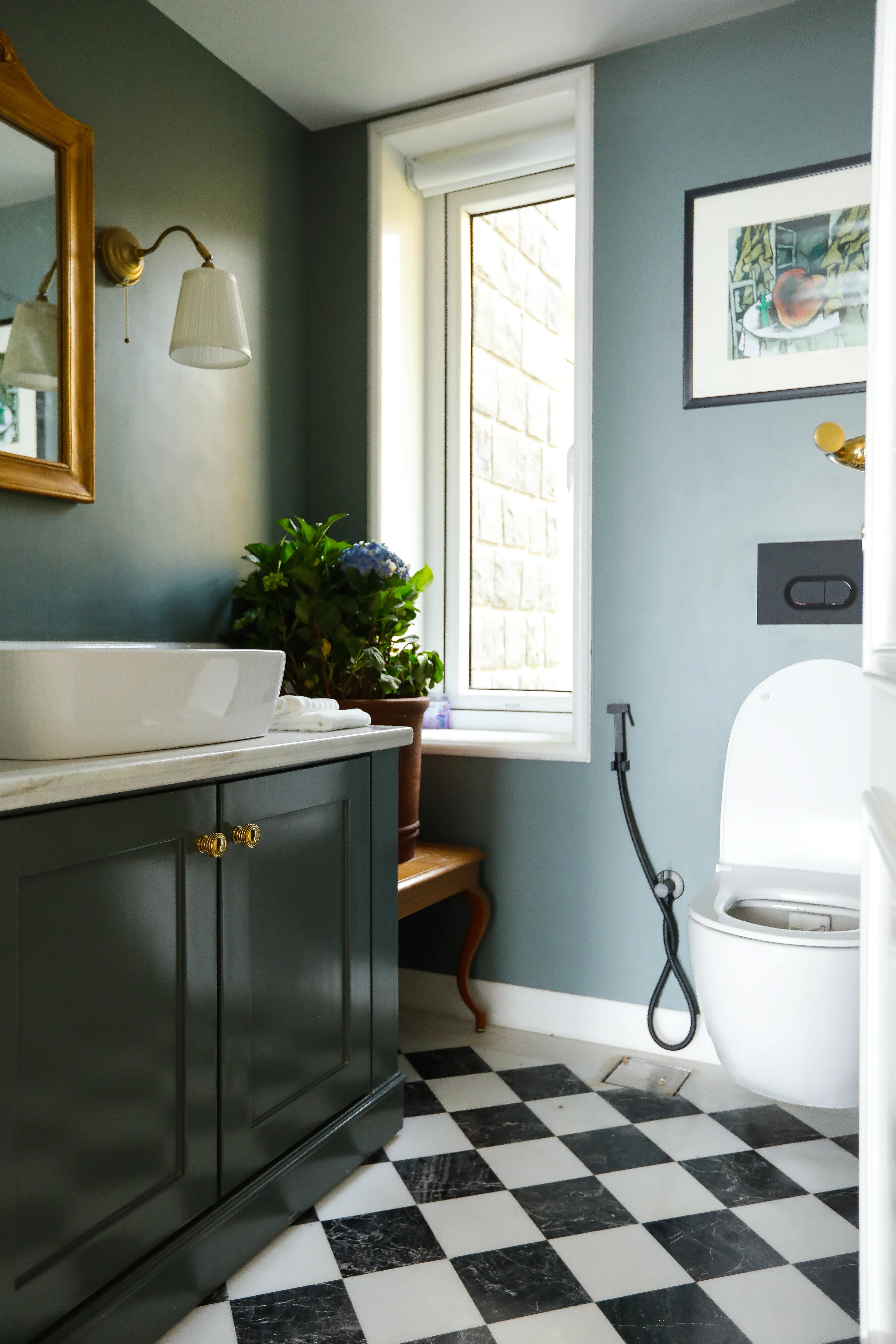 The blue bathroom with patterned floor tiles at the Coonoor bungalow