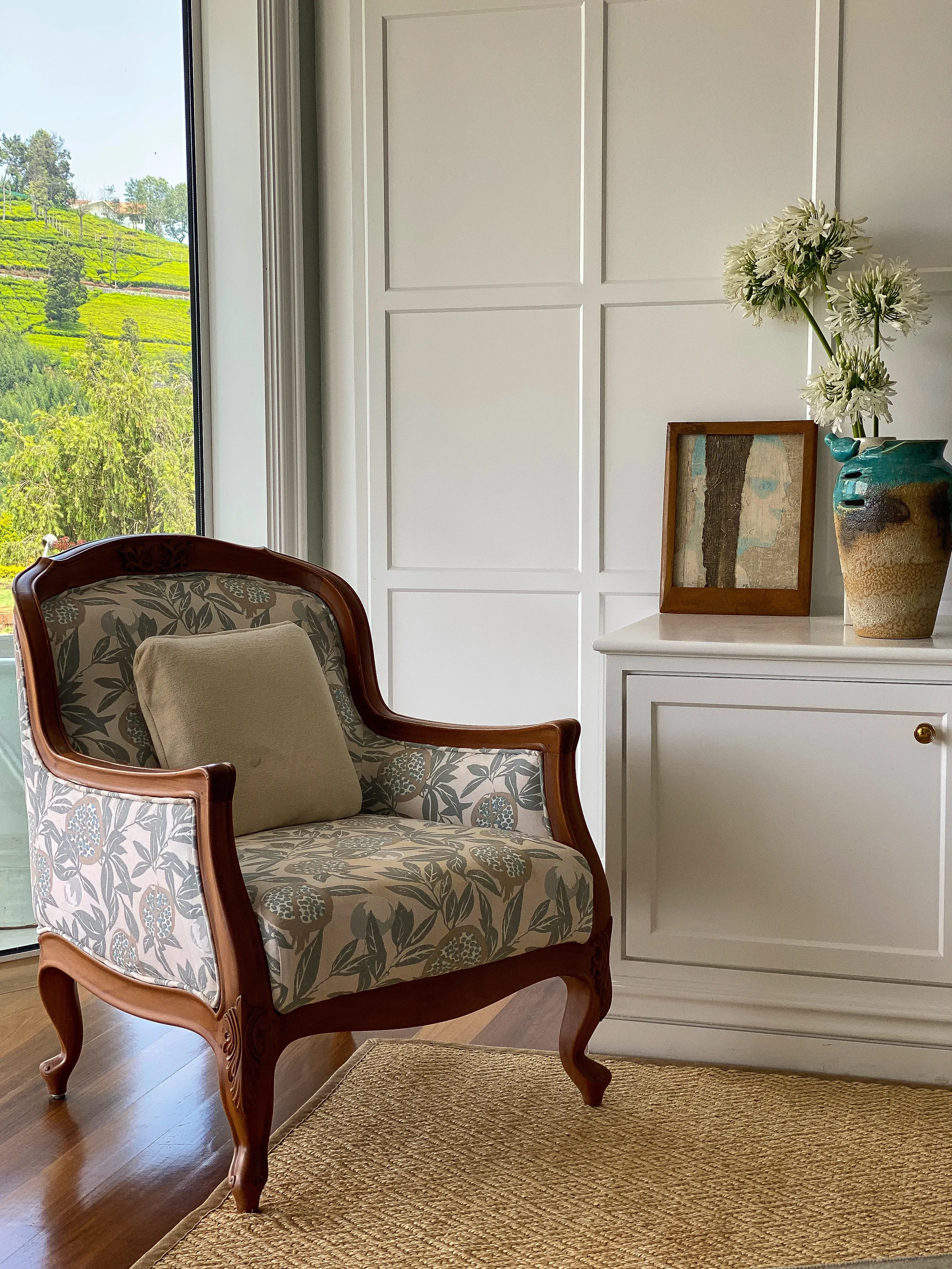 A brass mirror and wooden shelf at the Coonoor bungalow