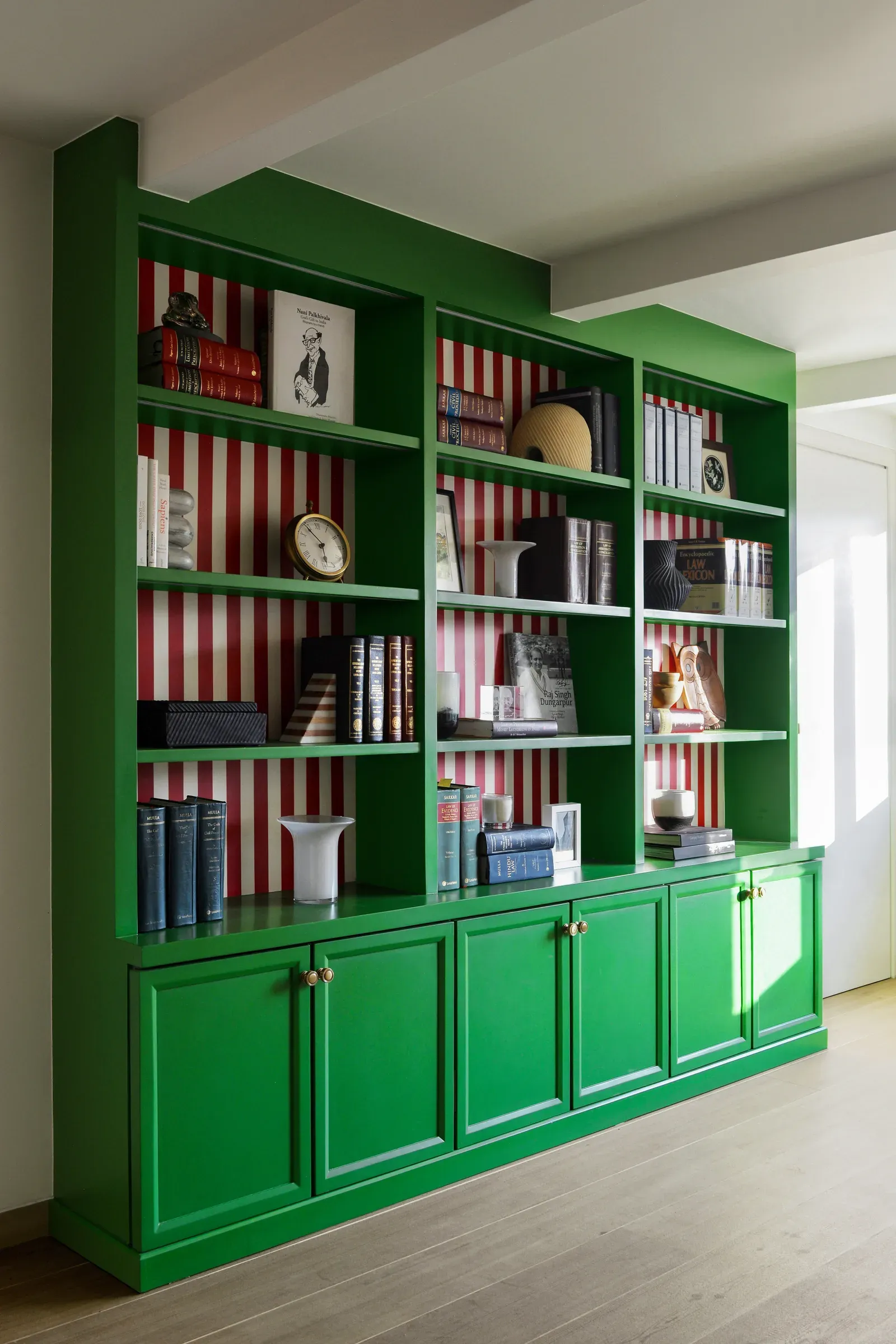 The green bookshelf at the Kala Ghoda chambers by Sonia Gehlot